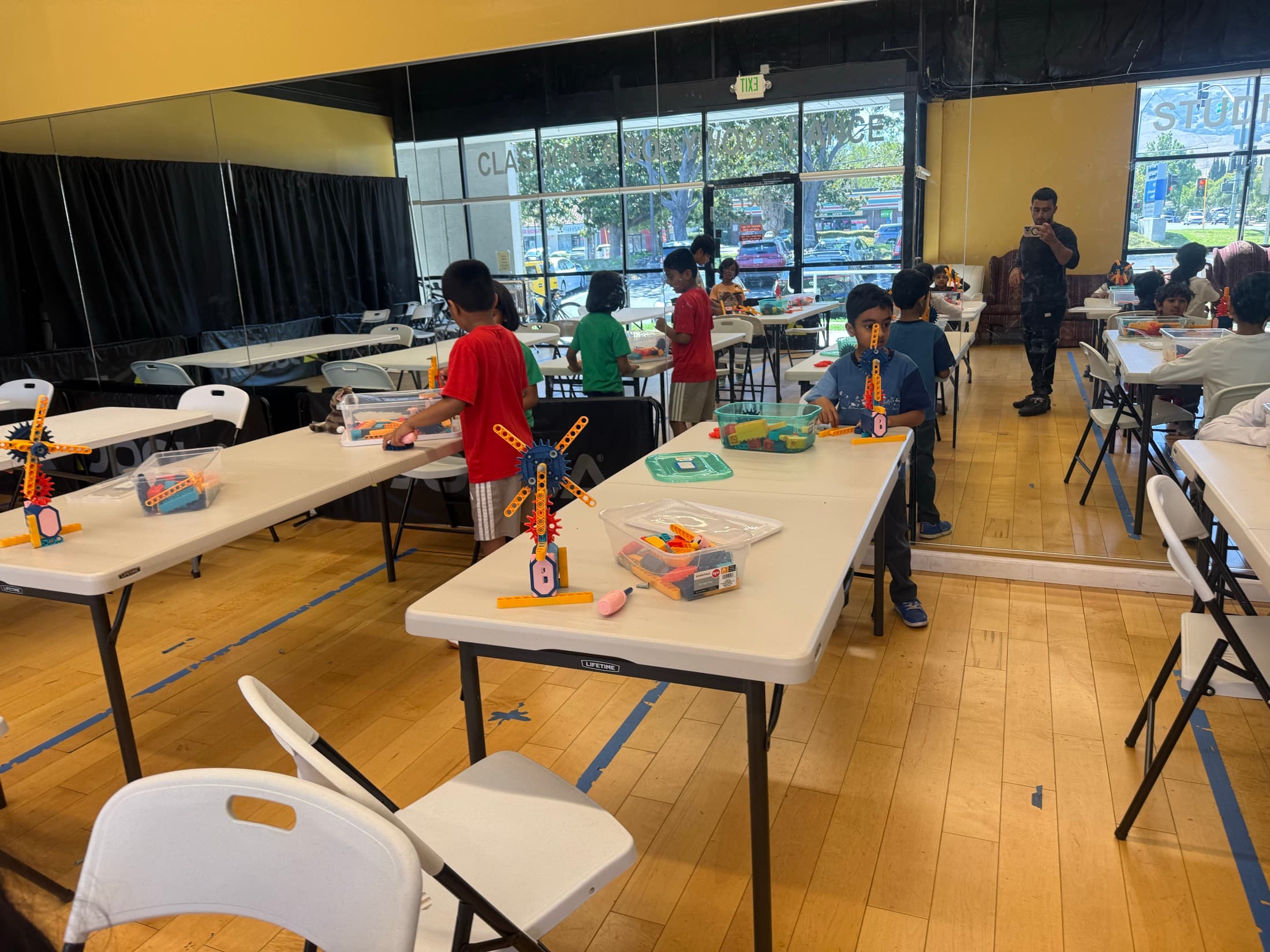 Children exploring hands-on building activities in the activity room