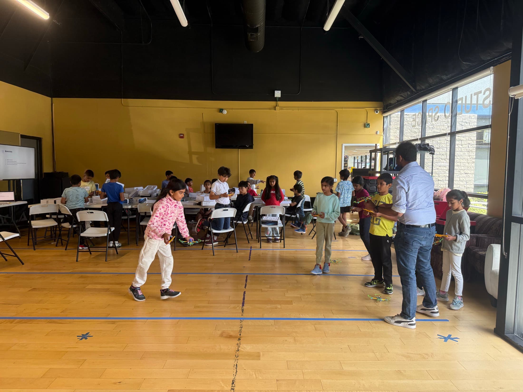 Children taking part in an indoor teamwork activity